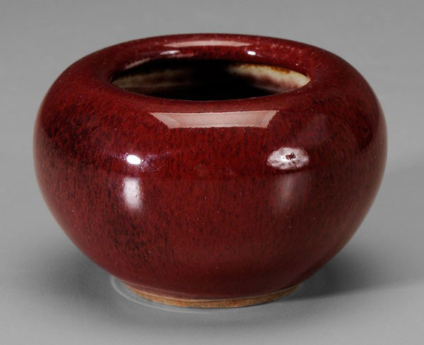Copper-Red Glazed Porcelain Water Pot: Chinese, thick interior and exterior glaze of rich strawberry with celadon edge at foot ring, crackled celadon base, 2-1/4 x 3-1/2 in., good condition, very minor scratches