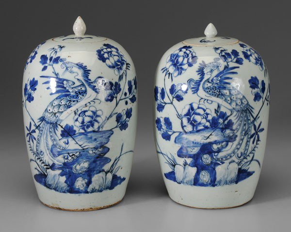 Pair Porcelain Lidded Jars: Chinese, pale celadon with blue and white decoration of phoenixes on rock formations, 12-5/8 x 13-1/4 in., one lid possibly replaced, minor interior rim chips, scratches, minor flaws