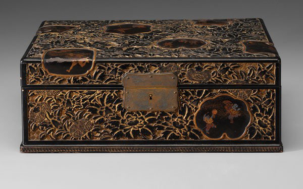 Carved Lacquer Box: Japanese, early 20th century, shaped [makie] cartouches with illustrations including badgers, toads, bats on a carved gilt and black ground of pomegranates and peonies, interior with lift-out tray, te