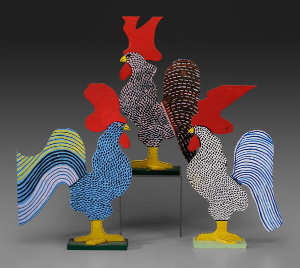 Three Marvin Finn Roosters: Kentucky, 20th century: carved and painted wood, all marked on base "Finn 90": each 25 in., one with repaired base, otherwise good condition Provenance: Collection of Phyllis George