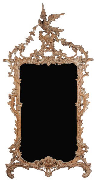 Chippendale Style Carved Mirror: 20th century, carved pine throughout with traces or gesso or white paint, 62 x 32 in., possibly resurfaced, scattered minor cracks and repairs Provenance: Collection of Phyllis George