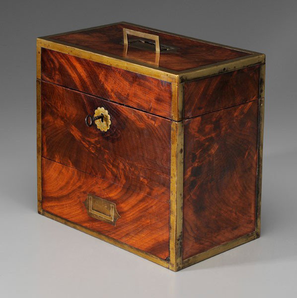 Traveling Apothecary: British, early 19th century, brass-mounted figured mahogany case, lift top with compartments below, pull-out drawer with compartments and pin lock, 10-1/2 x 11 x 6-3/4 in.; with 22 lidded clear glass 