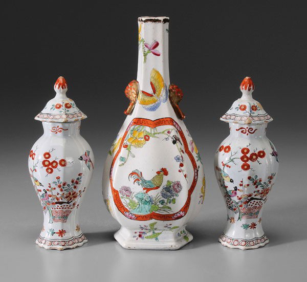 Pair Delft Polychrome Urns, Vase: Dutch, early 18th century, earthenware with tin oxide glaze, painted and enameled decoration: two diminutive lobed urns with lids, 7-1/2 in., [glaze chips on finials and lids, wear and glaze chips on