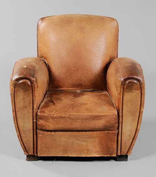 Art Deco Leather Club Chair: French, early 20th century, upholstered in camel-colored leather on wooden feet, 32 x 36 x 39 in., surface wear, cracking, stains, color variation and other distress to leather