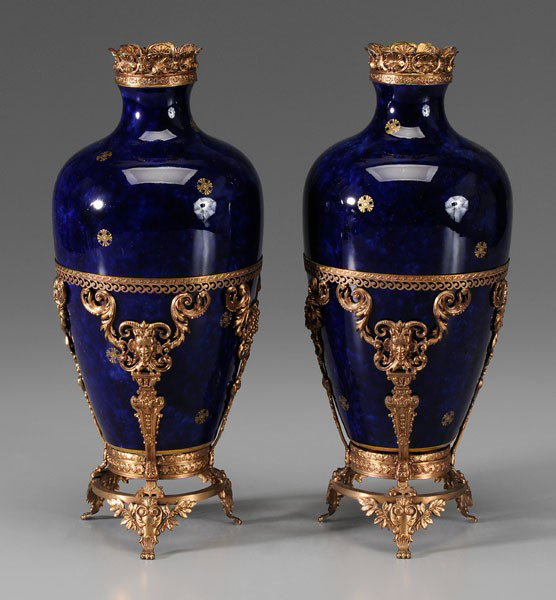 Pair Sèvres Vases: French, early 20th century: rich cobalt glaze with scattered gilt decoration, gilt metal shell rims, red-printed mark "RF/Doré Sèvres/1910", and green-printed mark with "S" in triangle with "1903", 