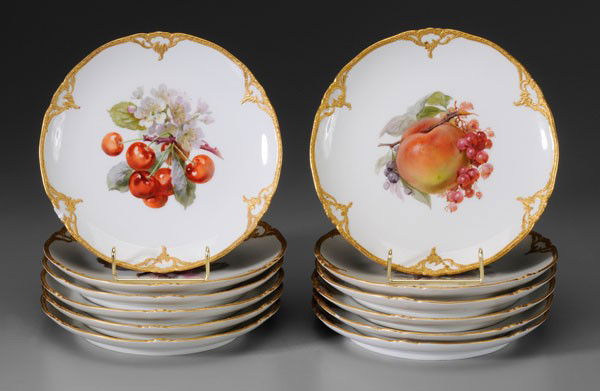 Set of Twelve KPM Plates: German, 19th century: each with different hand-painted fruit cluster and fine raised gilt borders, red-printed KPM mark and blue scepter mark under glaze, 8-1/2 in., two with 1/4 in. to 1/2 in. rim ch