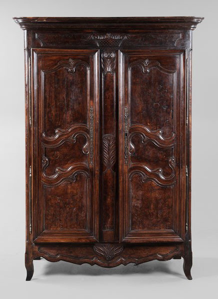 Provincial Louis XV Carved Armoire: French, 18th century, walnut, oak and other mixed woods, removable cornice over basket-carved frieze, two carved and paneled doors with inset burlwood panels, original steel hinges and escutcheons, 83