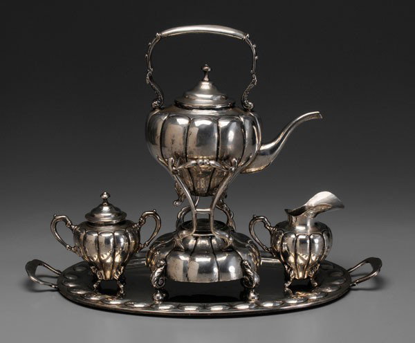 Sterling Tea Service, Tray: Mexican or Peruvian, 20th century: melon forms with scrolled handles and feet: 16-3/4 in. hot water kettle with matching creamer, covered sugar and 22-1/2 in. two-handled tray, marks for "LM", no mono
