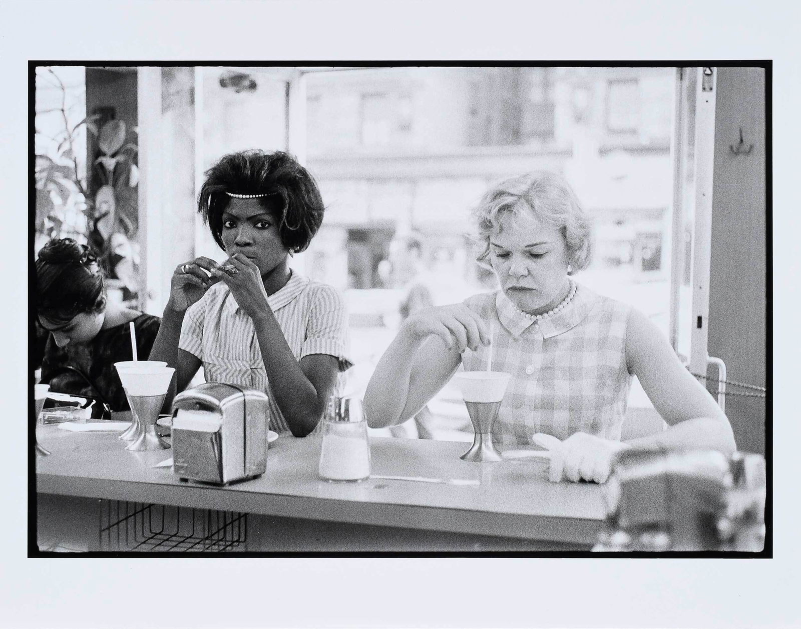 Bruce Davidson: (American, b. 1933) Women at Lunch Counter, signed, print verso gelatin silver print on paper, sheet 11 x 14 in.; unframed Provenance: Private Collection, Wisconsin