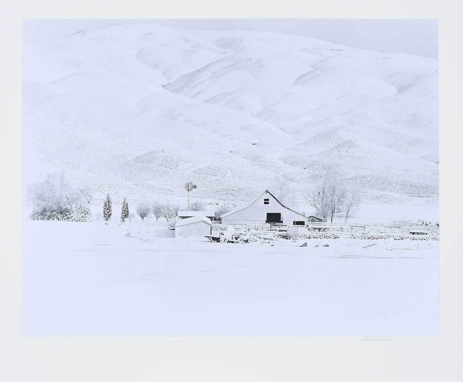 David Muench: (American, b. 1936) Nevada Ranch, 1967, Printed 1981, signed mount recto, artist stamp and print information verso, gelatin silver print, print 15 x 19-1/2 in.; Mount 24 x 28 in, unframed Provenance:
