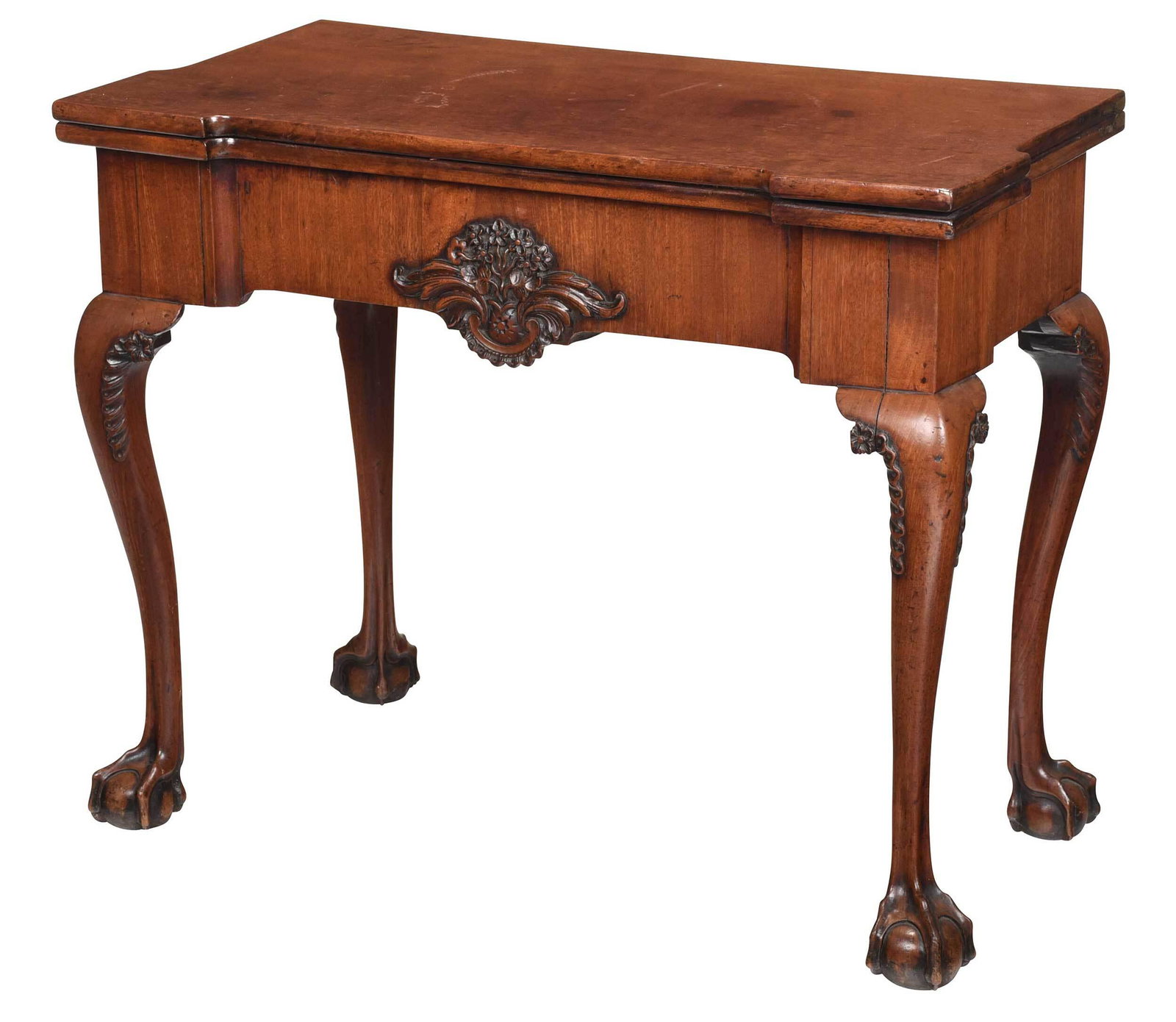 Georgian Carved Mahogany Fold Over Games Table: British, 18th/19th century, fold over top opening to flame style fabric lined playing surface, veneered skirt with carved applique, carved legs and ball and claw feet, hidden interior chip drawer, 28-