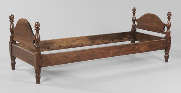 Tennessee Walnut Trundle Bed: 19th century, arched head and footboard with baluster-turned posts and acorn finials, poplar secondary, 25-1/2 x 73 x 28-1/2 in., refinished, one pin missing, scratches, abrasions, otherwise good cond