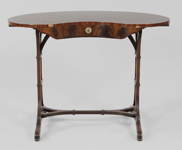 Regency Style Kidney-Form Writing: Table, British, 20th century, drawer with label "Georgian Furniture by Frederick Tibbenham Ltd., Ipswich, England", single dovetailed drawer and trestle-form base, 29-1/4 x 40-1/4 x 23 in., surface we