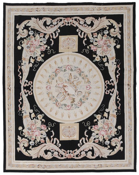 Needlepoint Rug: 20th century, Aubusson style, circular central medallion with floral wreath and bellflower border on black ground, cornucopias of flowers and scrolls, three panels joined, 7 ft. 8 in. x 10 ft. possibl