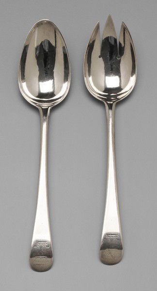 Two Hester Bateman Spoons: downturned oval handles, marks for Hester Bateman, London, 1778, heraldic devices, 8-3/4 in. one with tines added to bowl; one with repaired tip; both with buffed bowls, light scratches Provenance: Pr