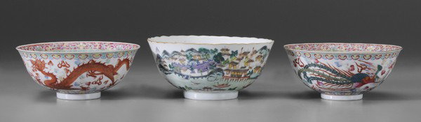 Three Chinese Porcelain Bowls: pair [famille rose] with central coin surrounded by bats, exterior with exotic birds and dragons, six-character mark, 3 x 6-1/4 in.; one [famille verte] with scalloped gilt rim, harbor scene with boat