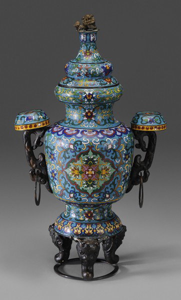 Lidded Cloisonné Urn: Chinese, 19th century, gilt bronze Buddhist lion finial above lobed body, mounted on two tripod bronze mounts with horned human heads, bronze handles with circular platform mounts, 21 in., generally g