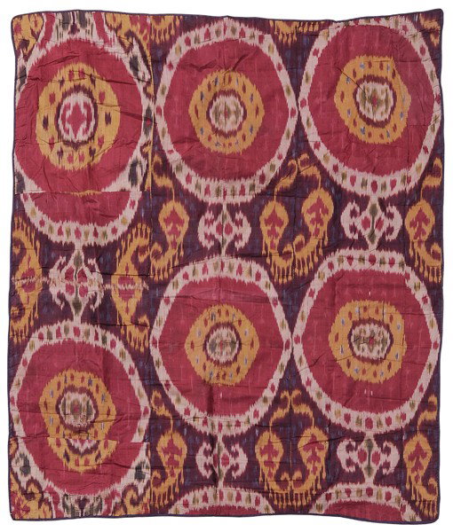Silk Ikat: Central Asia, possibly 19th/early 20th century, seven pieced panels, lined with cotton floral printing, purple silk binding, 41 x 48 in., scattered areas of shattered silk, light stains verso Provenan
