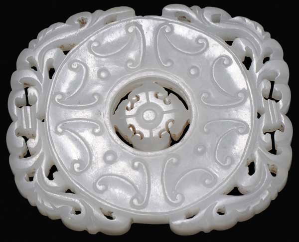 White Jade Disc: Chinese, 18th century, revolving central disc, addorsed scrolls carved in low beveled relief, raised nipple motif verso, natural fissure across center, 42 grams, 2-1/2 x 2 in., excellent condition Pro