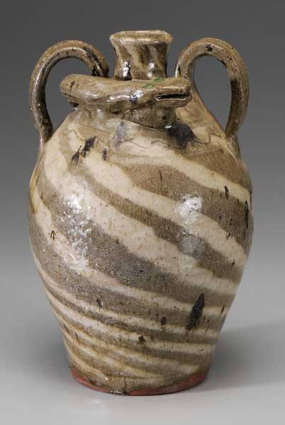 B.B. Craig Swirl Snake Jug: (Burlon Craig, Lincoln County, North Carolina, 1914-2002), two handles intertwined with snake, globular green eyes, base impressed "BB Craig, Vale, NC", 13 in., excellent condition Provenance: Private