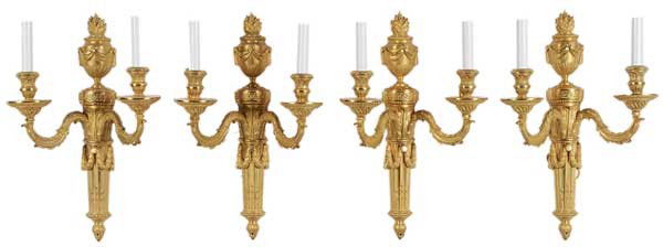 Set of Four Louis XVI Style Gilt: Bronze Sconces French, modern design attributed to M. E. Dupont, each shaped as torch with flaming urn finial above tapered and fluted torches and two arms with candle style fixtures, 17-1/2 in., exce