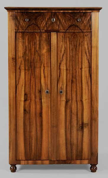 Biedermeier Walnut-Veneered Cabinet: Continental, 19th century, highly figured walnut veneers, dovetailed drawer over two cabinet doors opening to shelved interior, drawer pulls and feet replaced, refinished, other minor surface wear and