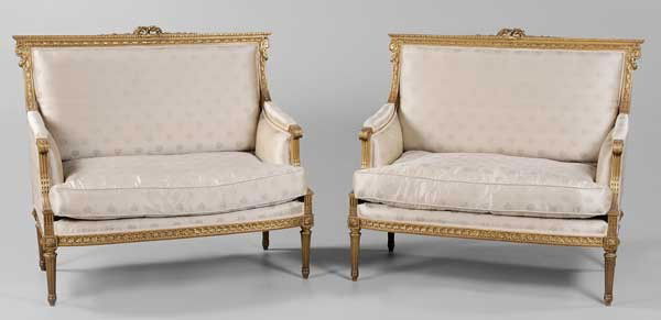 Pair Louis XVI Style Settees: French, early-20th century, in fine matching silk upholstery and with down cushions, 38-1/2 x 41 x 24-1/2 in., excellent condition, some gilding wear and losses, minor separations at joints Provenance