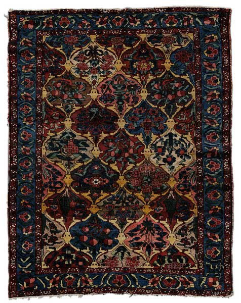 Baktiari Rug: Persian, early to mid 20th century, repeating floral panels with yellow borders, 5 ft. x 6 ft. 7 in., generally even low pile, no threadbare areas or repairs found, selvedge binding loose about 2 ft. 