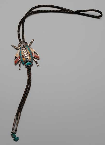 Frank Vacit Zuni Bolo Tie: Southwestern U.S., winged silver beetle set with turquoise, coral, onyx and shell inlays, silver tips, turquoise tassels, [fleur-de-lis] mark for Frank Vacit (working 1930s-1950s), 2-1/2 x 2-1/2 in., 