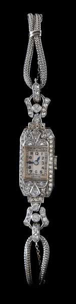 Patek Philippe Lady's Wristwatch: vintage platinum and diamond mechanical wristwatch, dial marked "Patek Philippe & Co., Geneve", accented with 82 diamonds, total estimated weight 1.5 cts., color F-G, clarity VS, woven 14 kt. white go