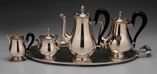 Four-Piece Christofle Silver-Plated: Tea Service French, 1935-1983, dart-and-palm borders, bud finials, black wooden scroll handles, 9-3/4 in. coffeepot with matching teapot, creamer, covered sugar and 25-1/2 in. tray, no monograms, (fiv