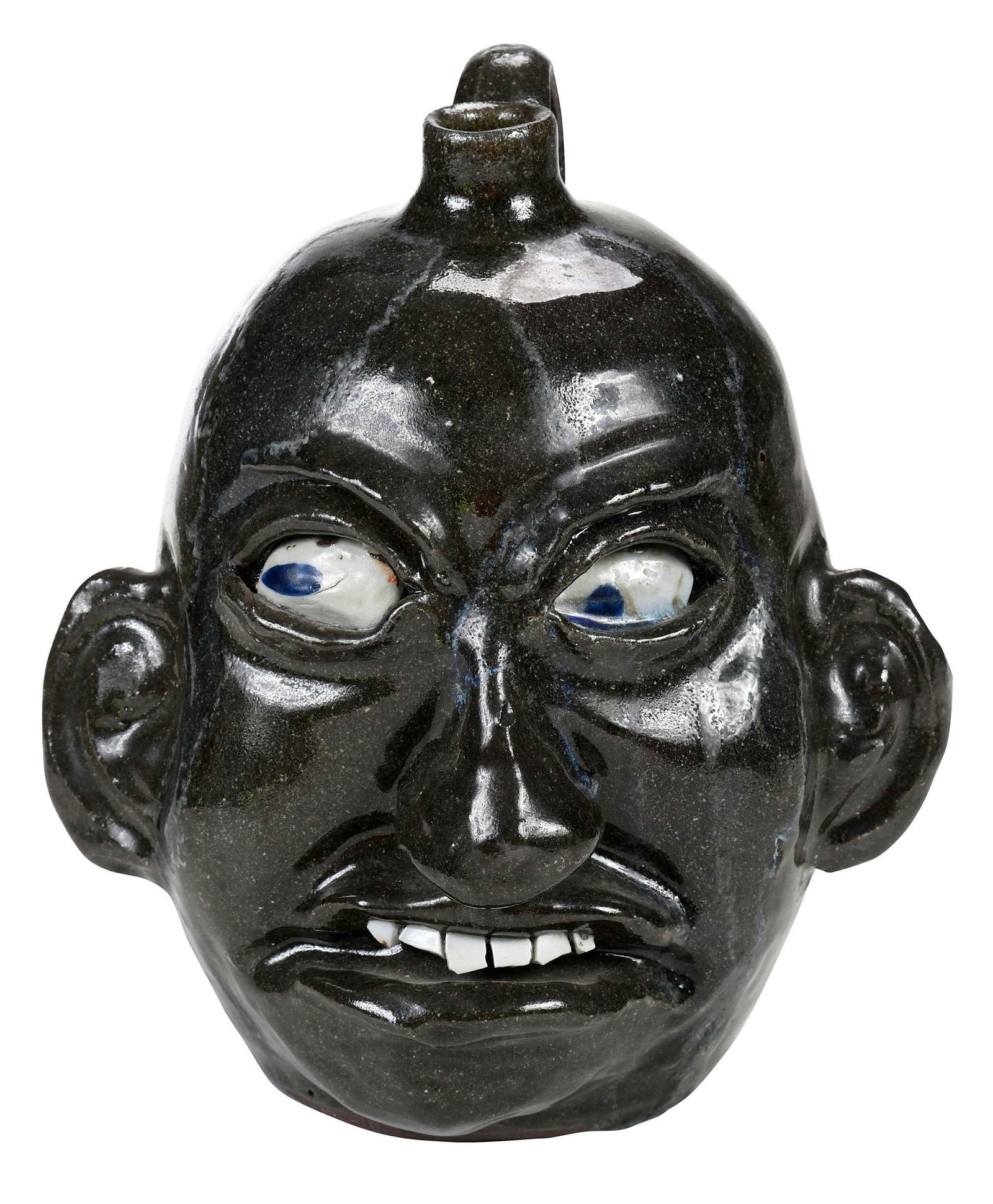 Chester Hewell Face Jug with Lanier Meaders Birthday Inscription: (Gillsville, Georgia, 20th century) speckled olive green alkaline glaze, two large glass runs down from spout, applied facial features, inset kaolin eyes with blue painted pupils, broken china teeth,