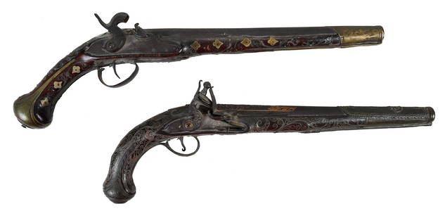 Two 19th Century Pistols with Wire Inlay: possibly Ottoman, one percussion and one flintlock operation, each with ornate brass decoration and wire inlay throughout, longest 18 in. overall Provenance: Collection of an Important Atlanta, Georg