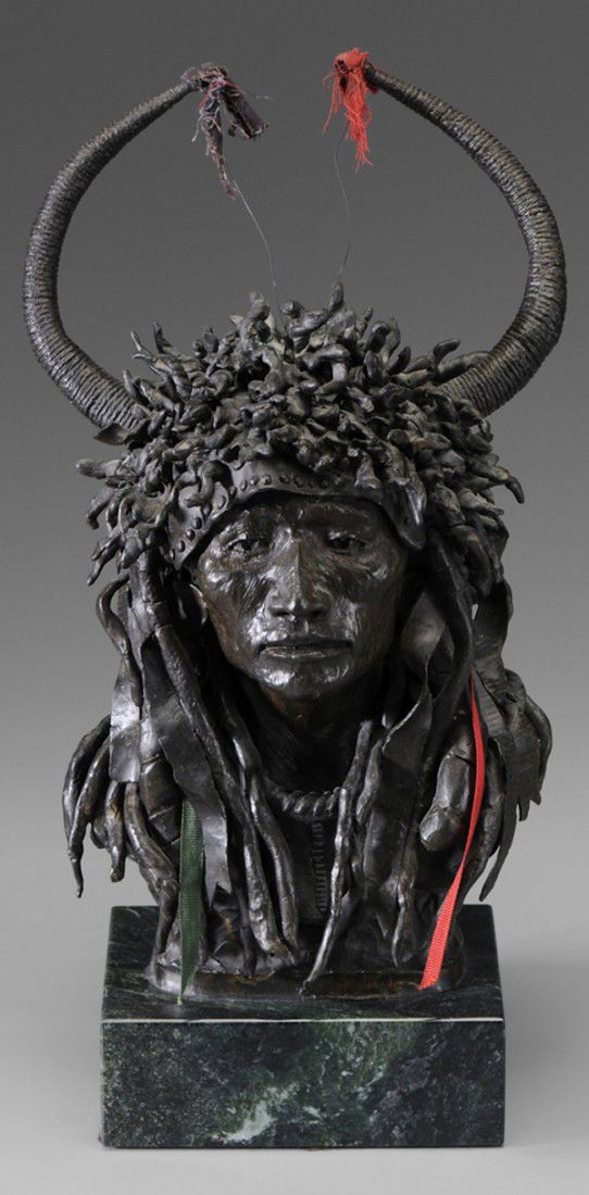 Michael B. Coleman: "(Utah, born 1946) Split Horn Ermine Tail Bonnet, edition 11/30, signed ""Michael Coleman 11/30"", patinated bronze on green marble base, 15-3/8 in., grime, corrosion on top of bonnet Provenance: J.N.