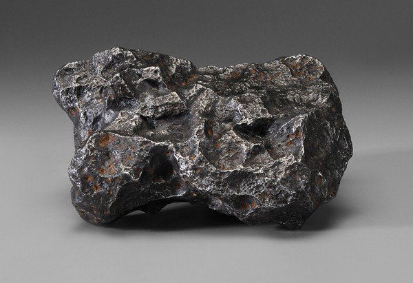 Fifteen Pound Meteorite: heavily remaglypted, possibly a Campo (Campo del Cielo, Argentina), approximately 3-1/2 x 8-1/4 in., excellent condition Provenance: Estate of the late Dr. Joseph Chandler Battaile, Sr., Memphis, Tenn