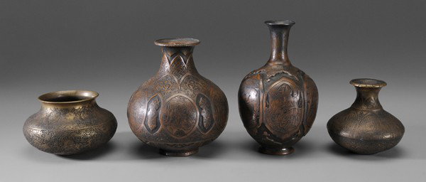 Four Islamic Copper Vessels: Middle Eastern, early 20th century: one bottle-shaped with six cartouches with raised and engraved decoration with figures, 8-1/2 in.; one globular, copper with six oval reserves flanked by arabesques