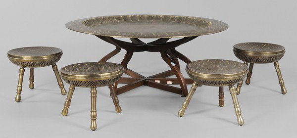 Middle Eastern Polychromed Low Table: "and Stools large charger-form tabletop with incised and polychrome floral decoration, 46 in. diameter, on folding mahogany stand, height with stand 20 in.; with four censer-form tripod stools, 11-3/4