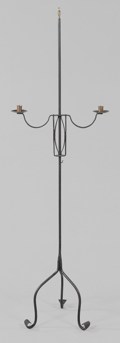 Wrought Iron Candle Stand: American or British, 18th century, adjustable bridge with small hook and two brass candle sockets on central shaft with brass urn finial, raised on three scrolled feet, 65 in., excellent condition, ca
