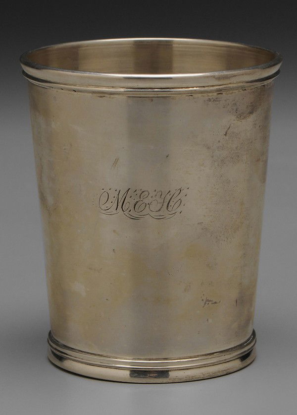 Kentucky Coin Silver Mint Julep: American, 19th century, tapered sides, reed border, marks for Henry Hudson (Louisville, Kentucky, working 1841-1880), monogrammed "MEH", 4.45 oz.T., 3-3/4 in., dents Provenance: Private Collection