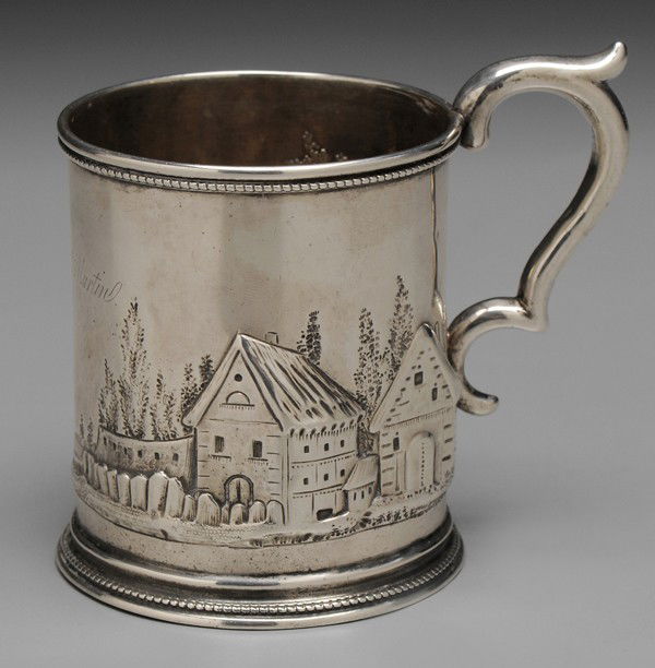 Charleston Coin Silver Mug: American, repoussé village scene, beaded border, marks for J. E. Spear & Co. (Charleston, South Carolina, working 1849-1851), inscribed "Edmund. Martin.", 4.67 oz.T., 4 x 4-1/2 x 3-1/4 in., partial m