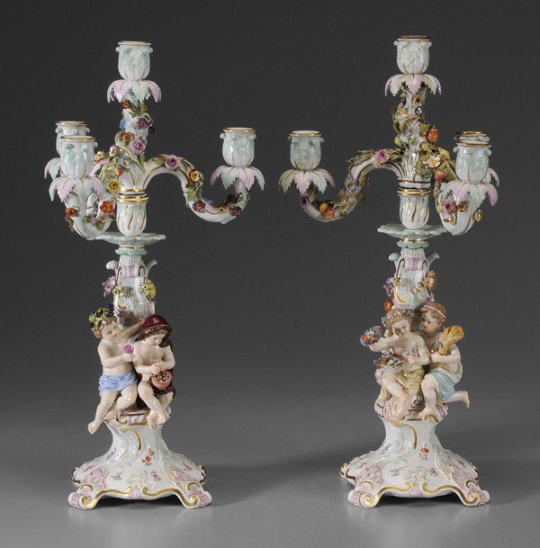 Pair Meissen Candelabra: German, early 19th century, each base with two figures representing the four seasons, children holding flowers, sheaf of wheat, glass of wine, warming hands over a small fire, each with removable tops