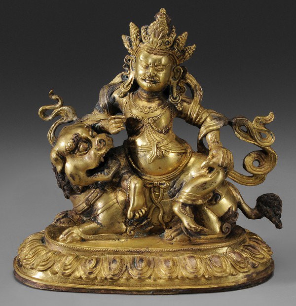 Buddhist Deity on Lion: possibly 18th century, gilt bronze five-crown figure, copper base with [vajra] symbol, 7-1/4 x 7 in., surface irregularities, some areas repaired and/or retreated