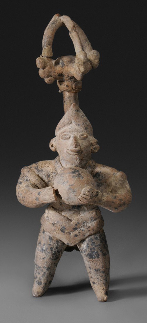 Colima Ball Player: standing male in buff terracotta holding orb in both hands and with extended openwork scepter above, cage-like finial, possibly 100 B.C.-100 A.D., 7-3/4 in., finial reattached and with repairs, ball a