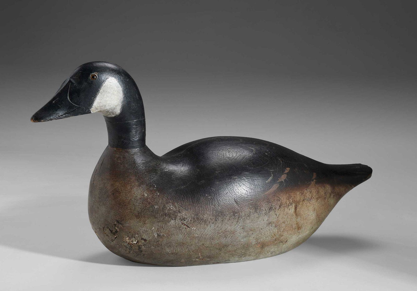Fine Mason Decoy Factory Premier Canada Goose: Detroit, Michigan, 1900-1910, Premier Grade, fine paint with detailed feathering, glass eyes, 12 x 24 x 9 in. Provenance: Collection of Jean and Jim Barrow