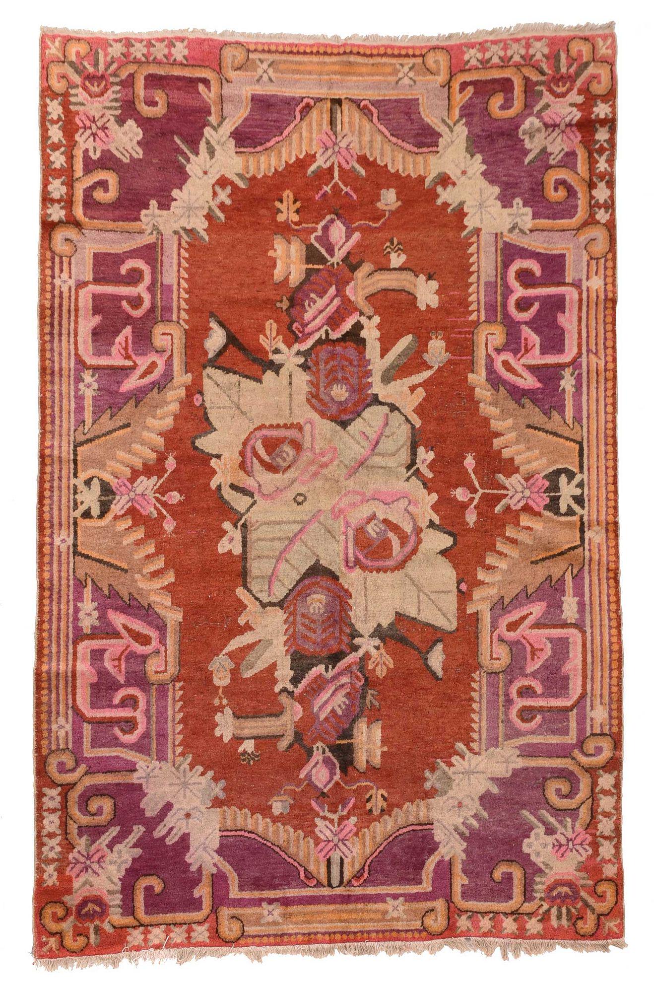 Tibetan Rug: 20th century, orange field with large central floral bouquet, purple border, 8 ft. 3 in. x 5 ft. 2 in.