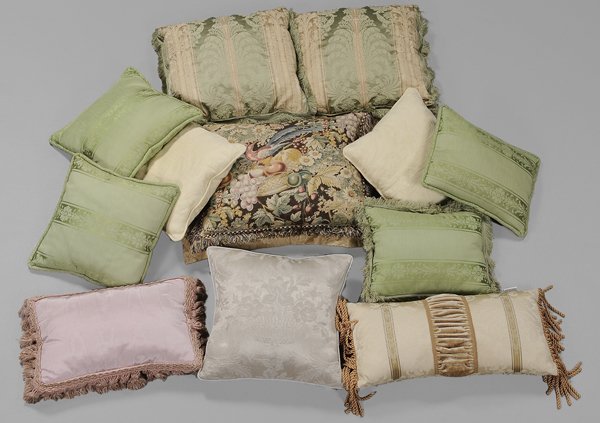 Twelve Decorator Pillows: mixed fabrics including damask and silk, various prints, some with tasseled edges, most feather or down-filled, some matched pairs, 14 x 14 in. to 24 x 19 in.,