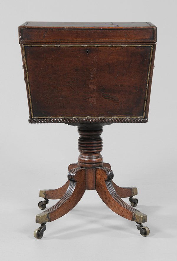 Regency Inlaid Mahogany Cellaret: British, 19th century, figured mahogany top set with Greek key banding, sides with applied brass molding, pedestal base with brass casters, 29 x 18-1/2 x 14 in.,