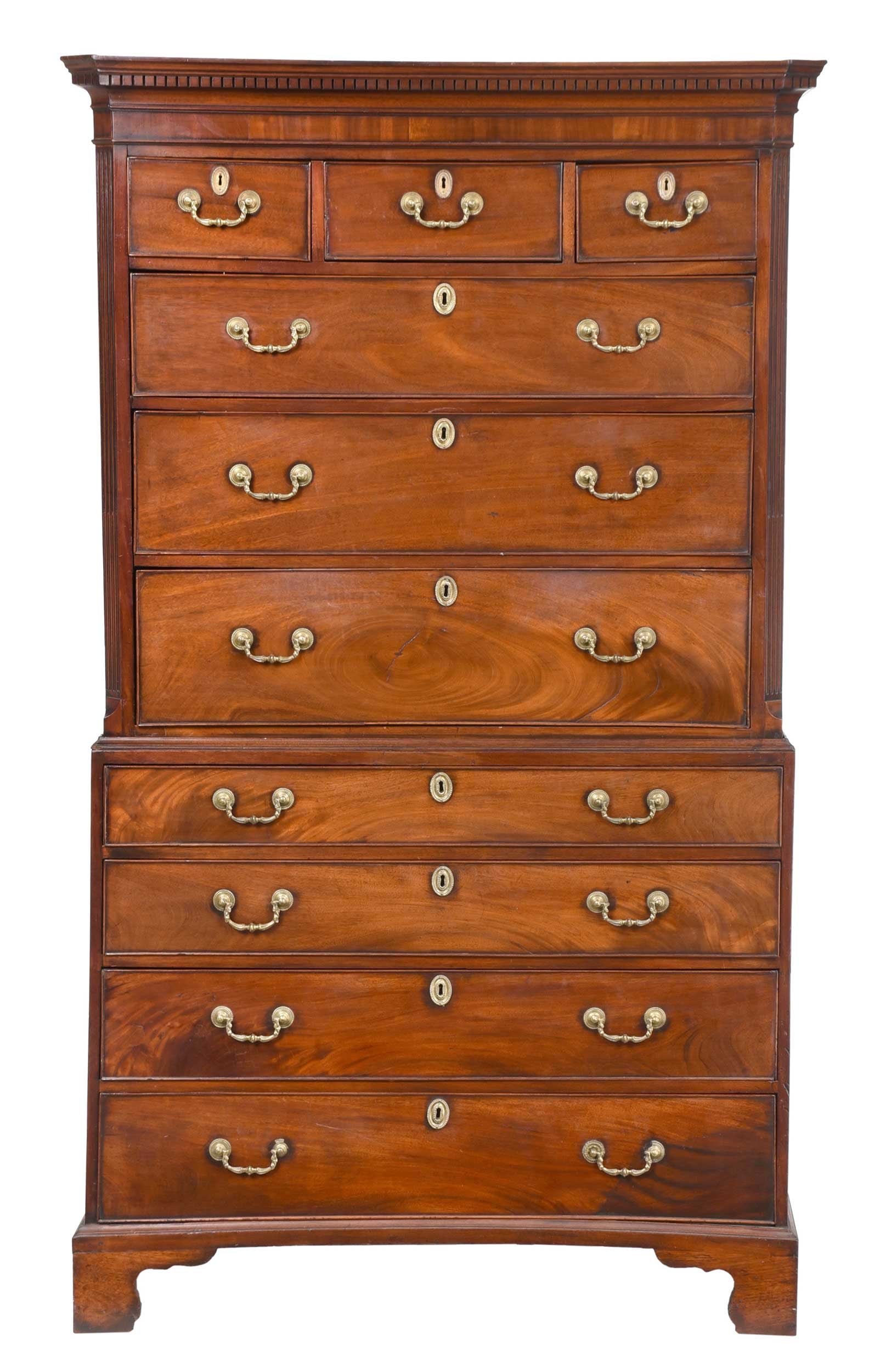 George III Mahogany Chest on Chest: British, late 18th century with later elements, dentil molded cornice, chamfered stop fluted stiles, three short drawers over three long drawers, lower case with four graduated long drawers, bracket f