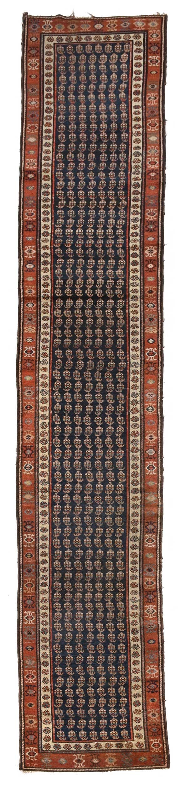 Persian Runner: early 20th century, blue field with boteh, rust colored field with geometric design, 2 ft. 7 in. x 14 ft. 10 in. Provenance: Estate of Donna Summer, Brentwood, Tennessee