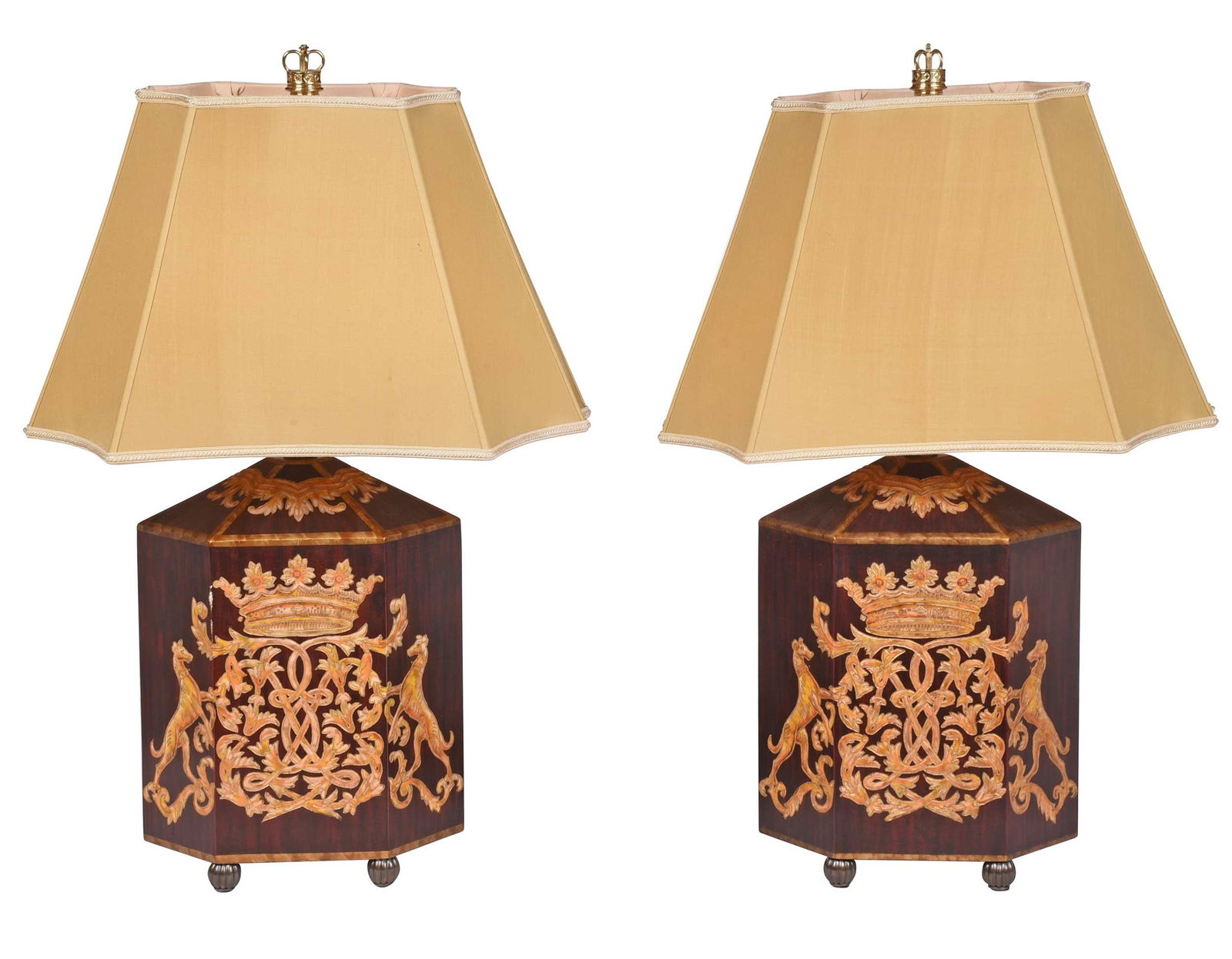 Pair of Contemporary Carved and Gilt Lamps: each of hexagonal form resembling tea caddies, carved and inlaid greyhound, crown, and scrollwork decoration, metal ridged ball feet, crown finial, 30-3/4 in. to finial, with shades Provenance: Estate